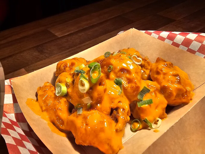 Saucy wings that make mouths water - before SnackSnap AI enhancement